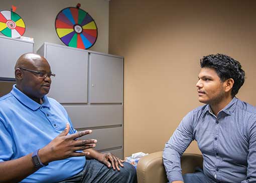 student and mentor talking