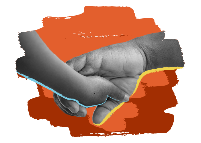 child's hand holding adult's hand