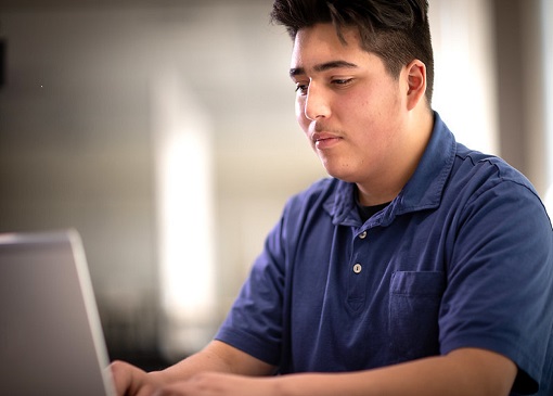 Student looking at laptop
