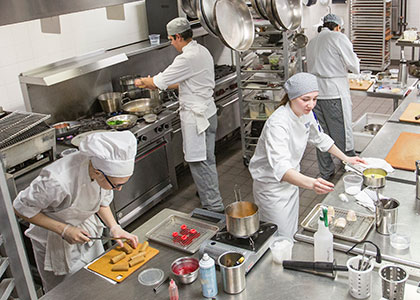 culinary arts program students at work in the kitchen
